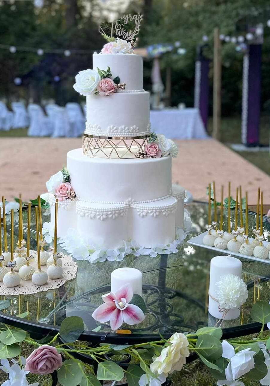 viva-margar-cakes-008 Outdoor white and blush wedding cake setup with floral accents and matching cake pops